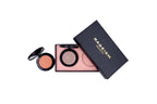 A flat-lay view of a RAGELEN Beauty makeup set on a white background, featuring a black textured box, an open multi-color blush compact, and a separate round orange-brown eyeshadow compact.