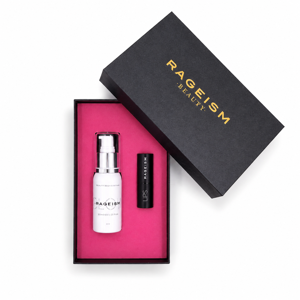 Rageism Beauty gift set featuring a white serum bottle with a silver pump and a black lip balm tube, presented in a black box with a bright pink interior, alongside the black outer lid with gold lettering.